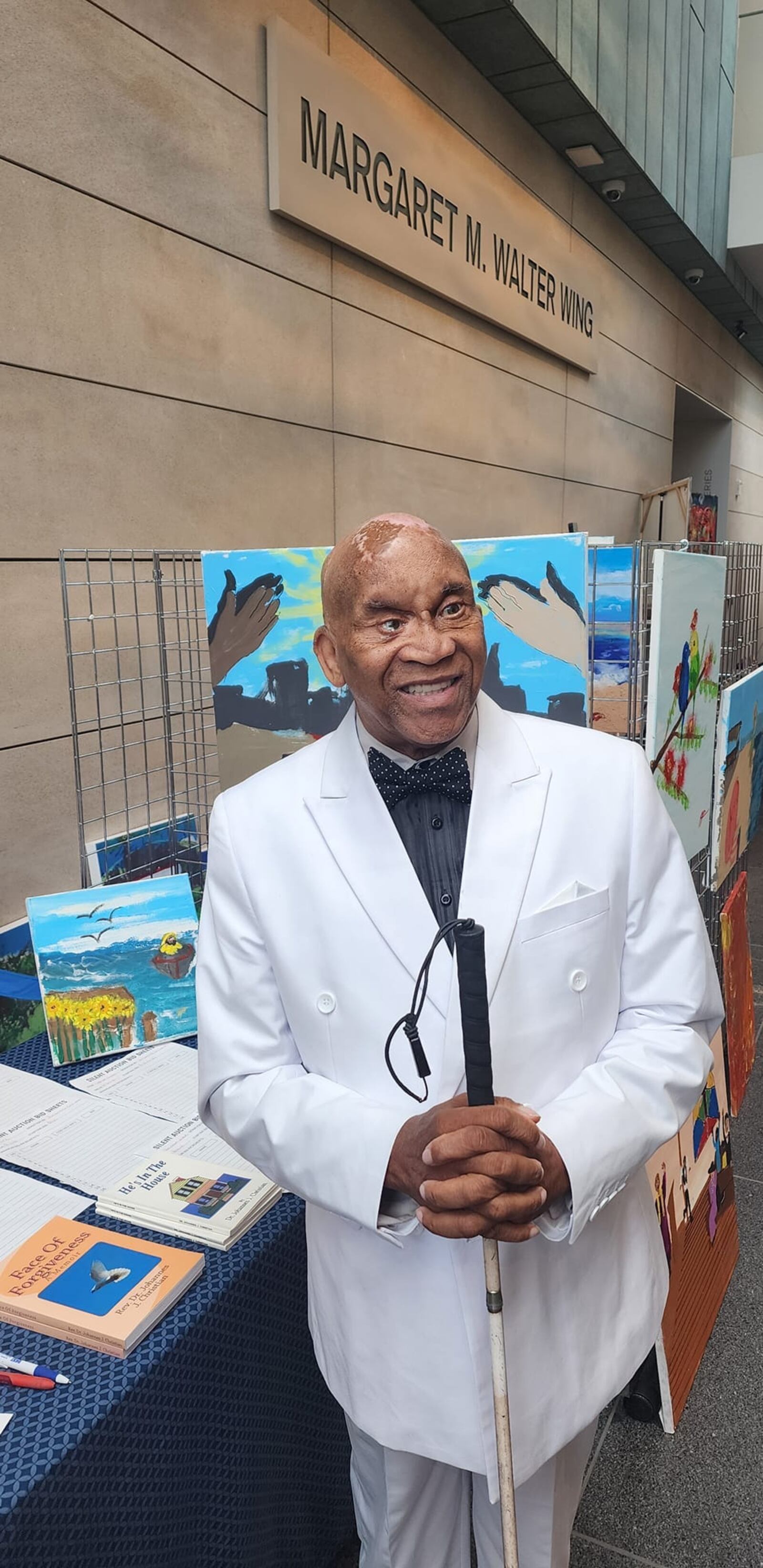 Columbus pastor Johannes Christian, blinded by a rock thrown from a Clark County highway overpass in 2001, is reinventing himself as a painter at age 73, with help from fellow artist Lanai Ashe. Contributed photo, courtesy Lanai Ashe