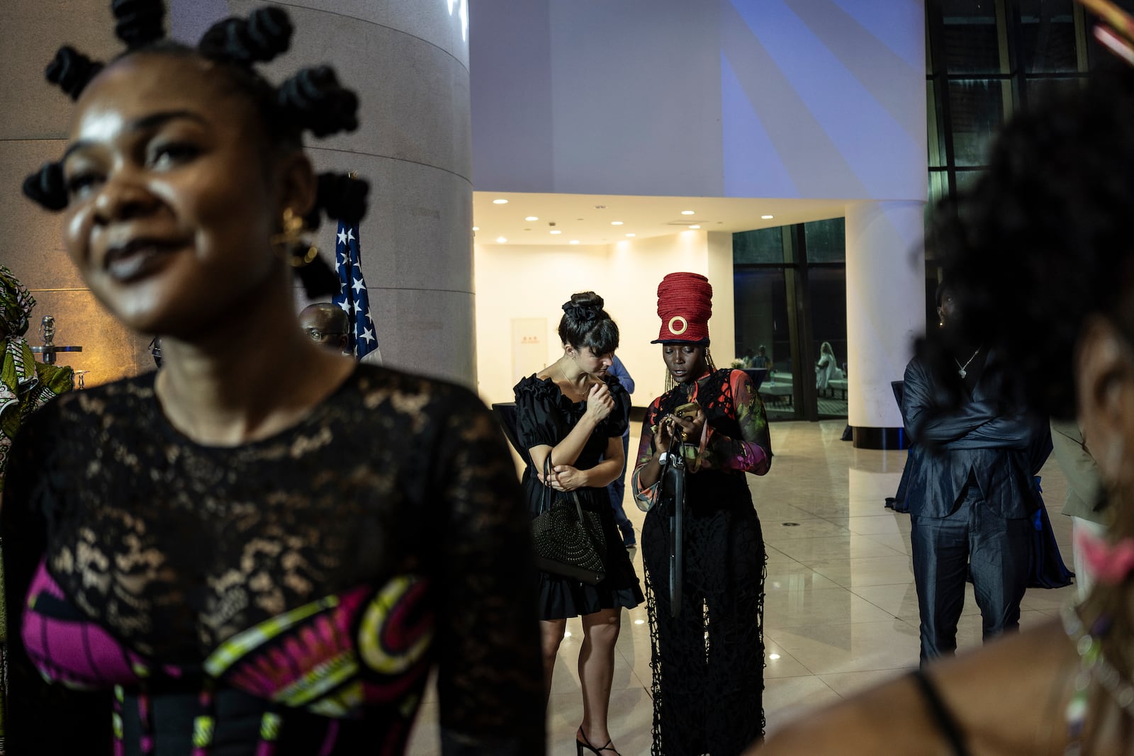 Visitors explore the international exhibit at the Dakar Biennale of Contemporary African Art in Dakar, Senegal, Friday, Nov. 8, 2024. (AP Photo/Annika Hammerschlag)