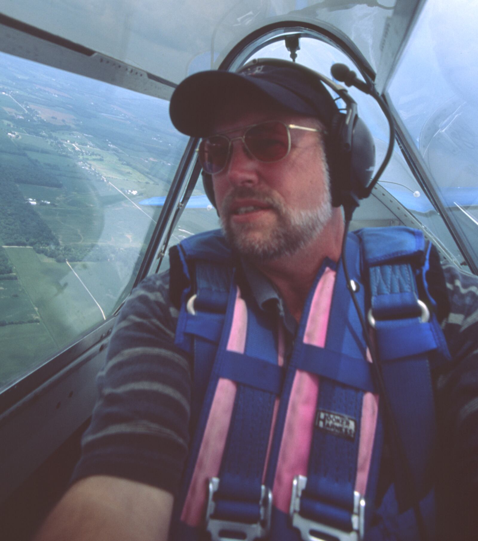 Timothy R. Gaffney makes a self-portrait in the back seat of Steve & Mary Dilda's SNJ N73RR "Two of Hearts" -- the same plane he made his first flight in at age 12 in 1963. (CONTRIBUTED)