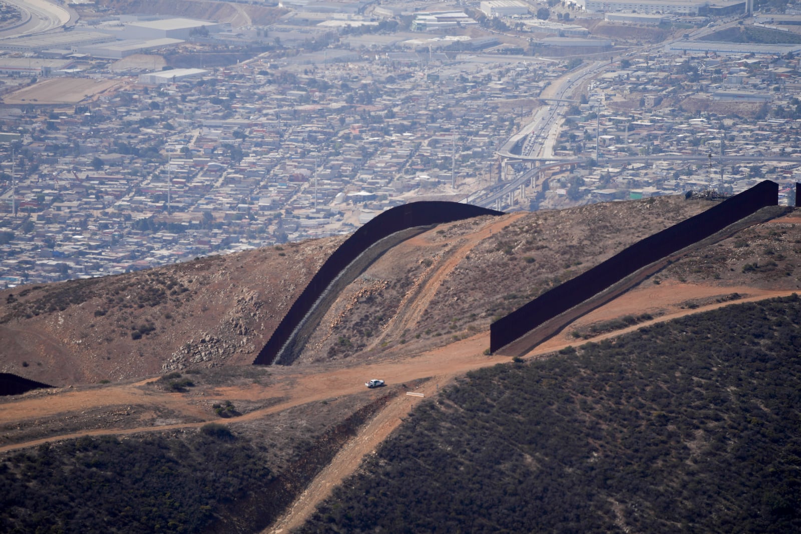 The U.S. Border with Mexico is seen in an aerial view Friday, Jan. 31, 2025, near San Diego. (AP Photo/Jae C. Hong)