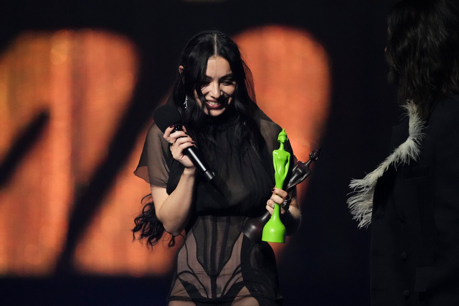 EDS NOTE: NUDITY - Charli xcx accepts the artist of the year award during the Brit Awards 2025 in London, Saturday, March 1, 2025. (Photo by Scott A Garfitt/Invision/AP)