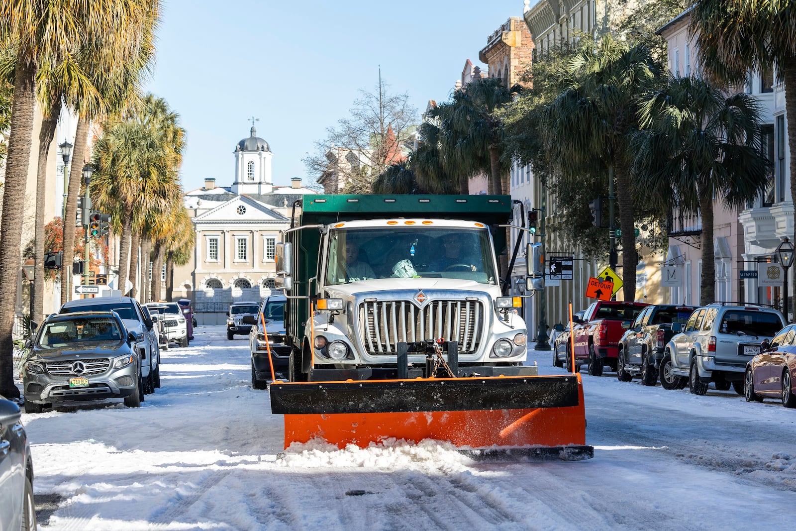 A City of Charleston snowplow clears Broad Street after a winter storm dropped ice and snow Wednesday, Jan. 22, 2025, on Charleston, S.C. (AP Photo/Mic Smith)