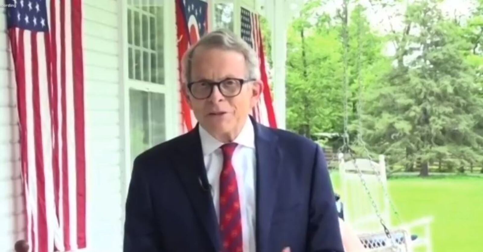 Gov. Mike DeWine speaks during a videoconference from the front porch of his home in Cedarville after his positive coronavirus test Thursday morning, Aug. 6, 2020, in Cleveland before he was to meet President Trump. A second test produced a negative result.