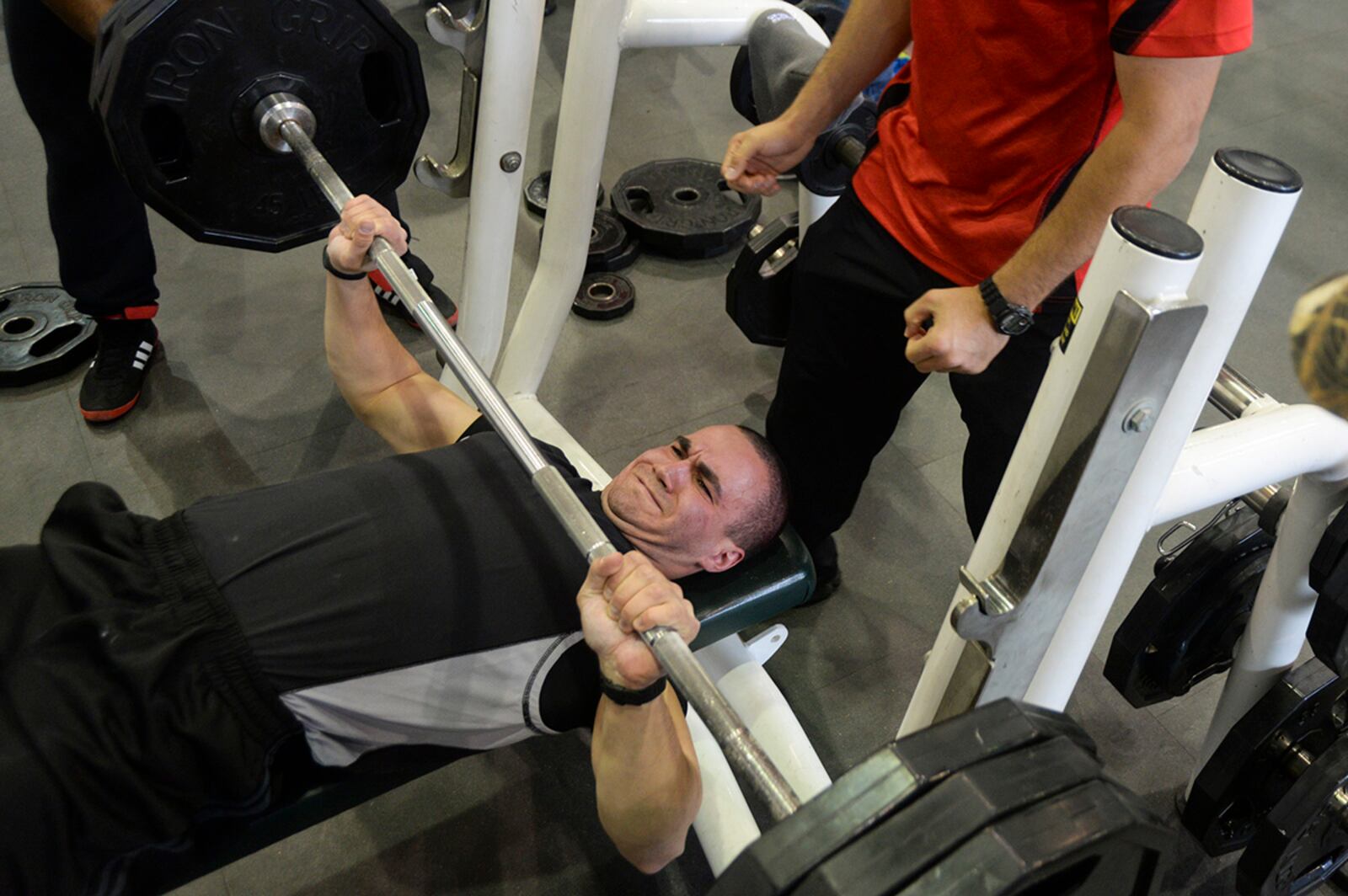 Senior Airman Bryan Hernandez, 88th Security Forces Squadron patrolman, participates in the bench press event during a powerlifting competition at Wright Field Fitness Center in 2014. U.S. AIR FORCE PHOTO/WESLEY FARNSWORTH