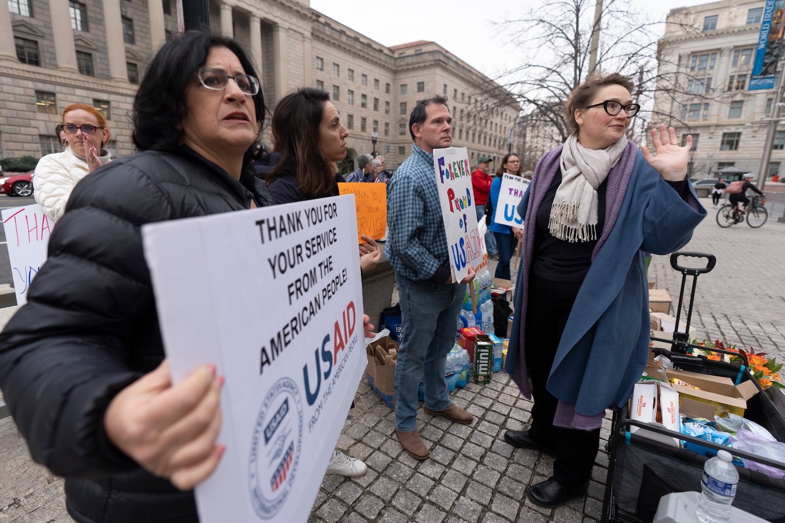 Former United States Agency for International Development (USAID) workers show their support to USAID workers retrieving their personal belongings from USAID's headquarters in Washington, Thursday, Feb. 27, 2025. (AP Photo/Manuel Balce Ceneta)