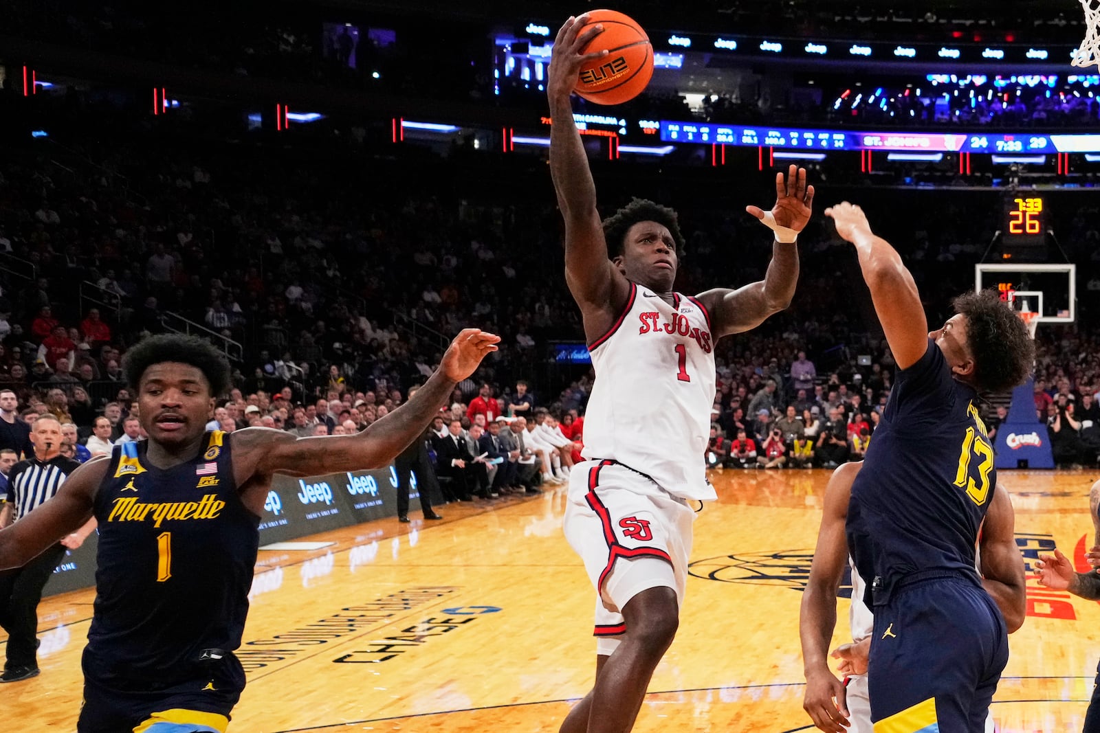 St. John's's Kadary Richmond (1) shoots over Marquette's Royce Parham (13) during the first half of an NCAA college basketball game in the semifinals of the Big East tournament Friday, March 14, 2025, in New York. (AP Photo/Frank Franklin II)