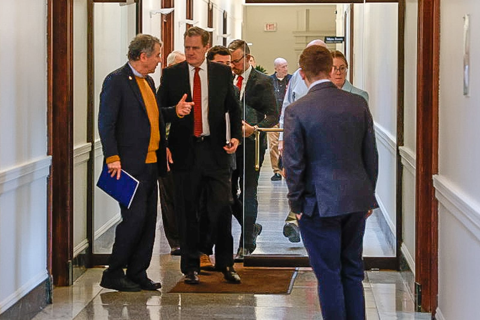 Ohio U.S. Senator Sherrod Brown (D-OH) left, and Ohio Congressman Mike Turner (OH-10) head to a press conference at Turner's district office in Dayton Monday February 26, 2024 concerning the Delphi salaried retirees pension. JIM NOELKER/STAFF