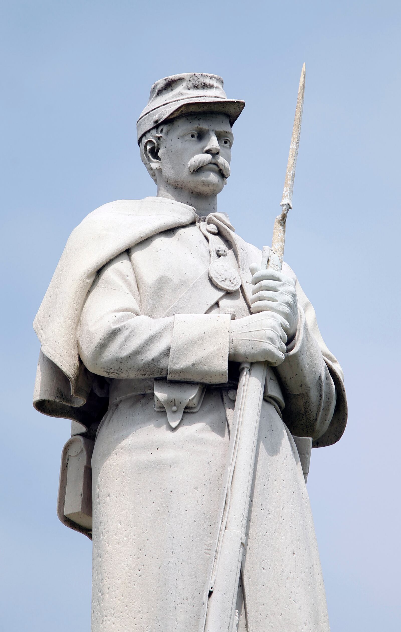 The Dayton Soldiers' Monument sits atop a hill at the center of the Dayton National Cemetery landscape. The cornerstone was laid in 1873, and it was completed in 1877.  The structure is composed of a 30-foot marble column on a granite base with an ornamental cap and soldier posed at parade rest.  TY GREENLEES / STAFF