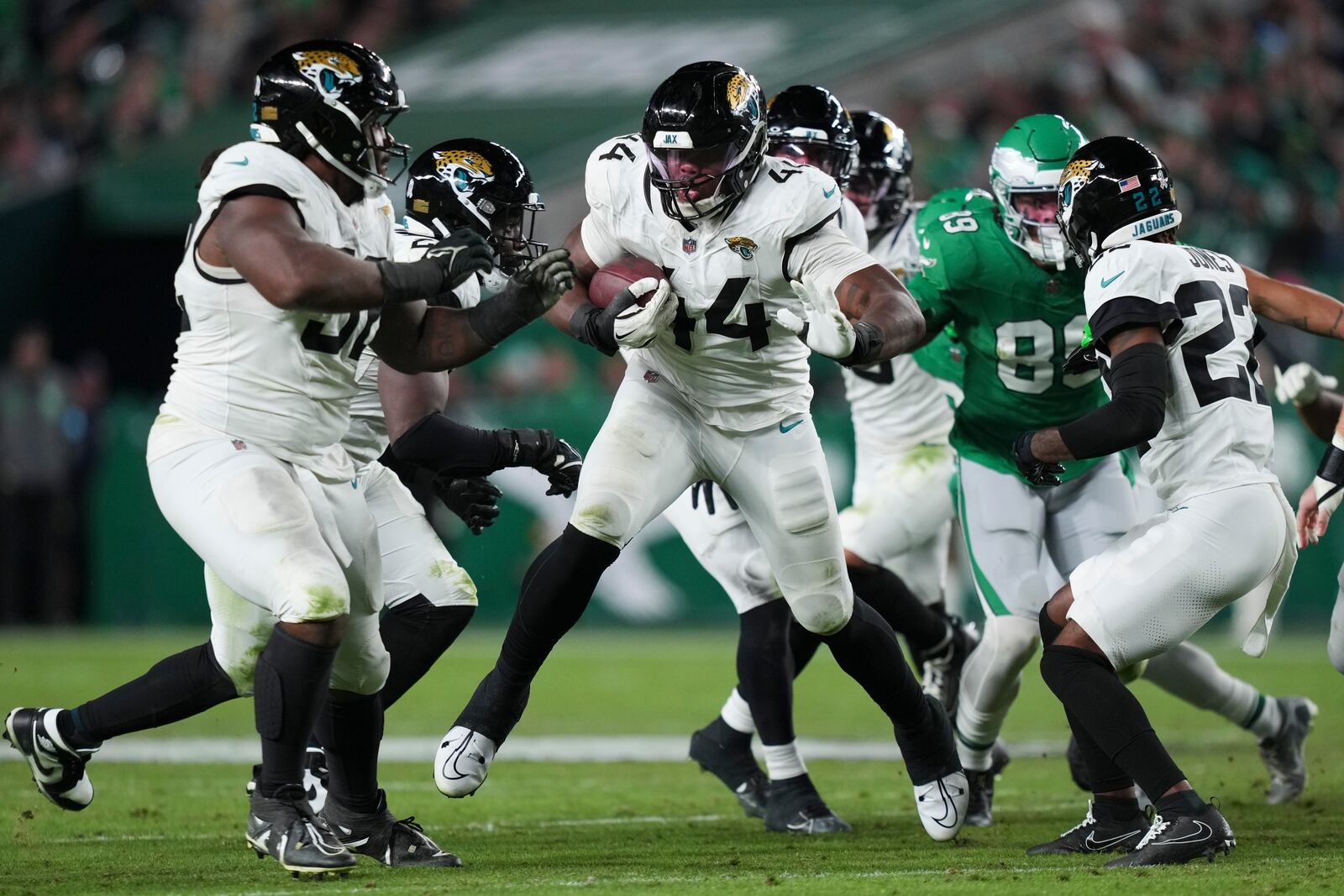 Jacksonville Jaguars defensive end Travon Walker (44) runs with the ball after recovering a fumble for a touchdown during the second half of an NFL football game against the Philadelphia Eagles on Sunday, Nov. 3, 2024, in Philadelphia.(AP Photo/Matt Slocum)