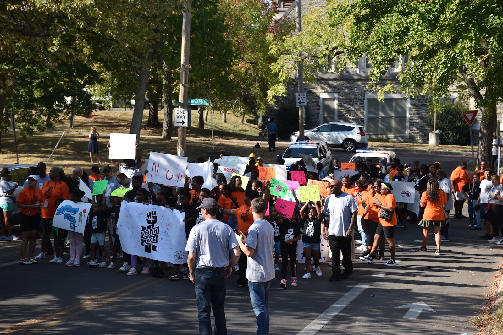 Kids, teens and adults marched down Broadway Street in northwest Dayton on Thursday as part of a peace march and rally in response to an increase in gun violence in the community. CORNELIUS FROLIK / STAFF