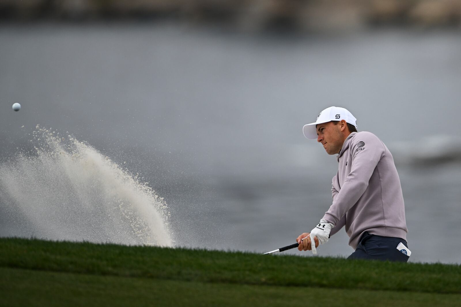 Jordan Spieth hits from a bunker on the sixth hole at Pebble Beach Golf Links during the second round of the AT&T Pebble Beach Pro-Am golf tournament, Friday, Jan. 31, 2025, in Pebble Beach, Calif. (AP Photo/Nic Coury)