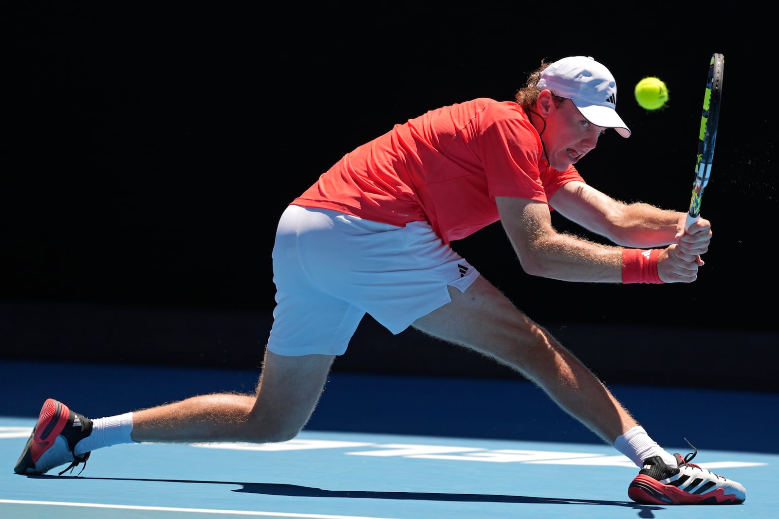 Alex Michelsen of the U.S. plays a backhand return to Karen Khachanov of Russia during their third round match at the Australian Open tennis championship in Melbourne, Australia, Saturday, Jan. 18, 2025. (AP Photo/Ng Han Guan)