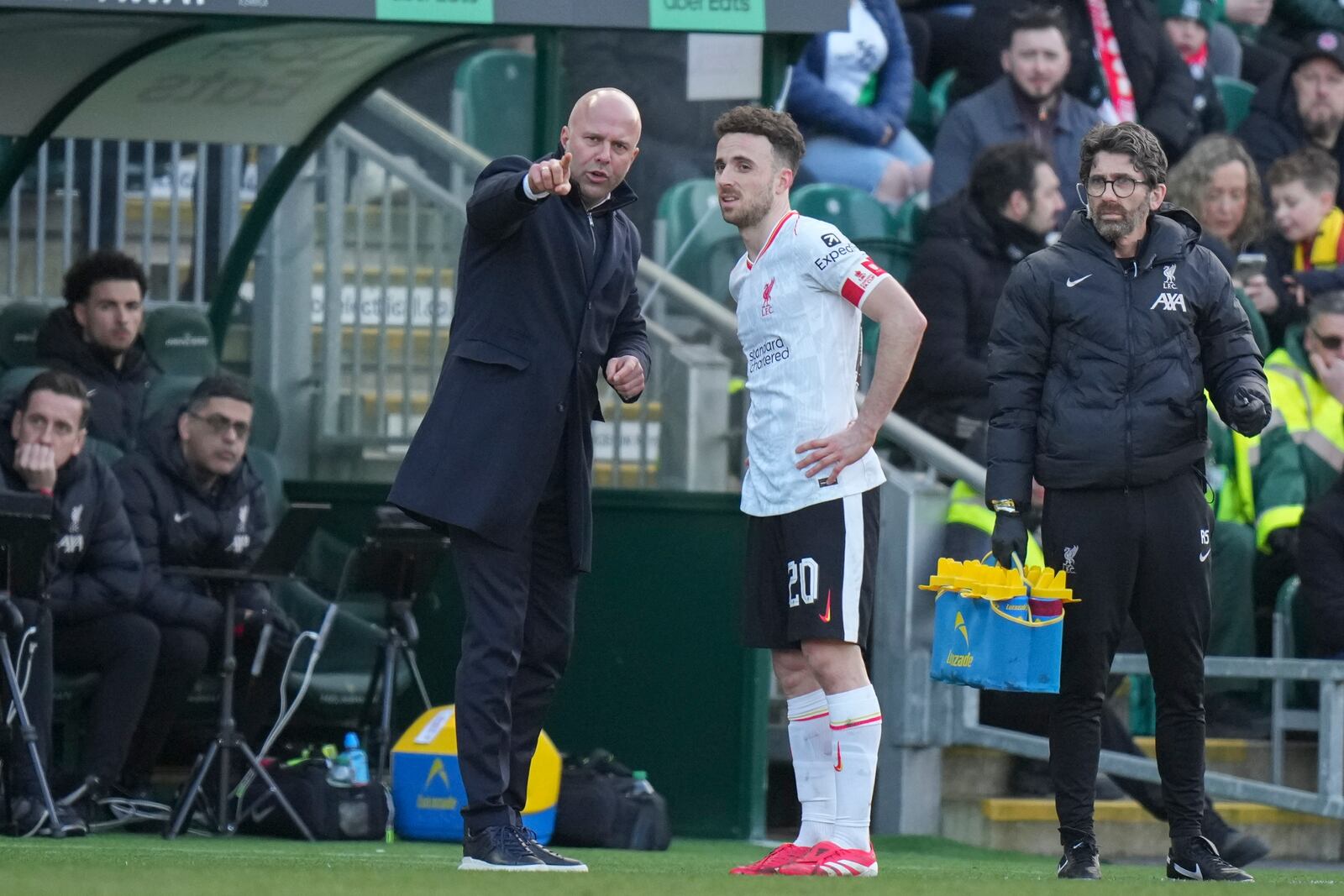 Liverpool's manager Arne Slot directs Liverpool's Diogo Jota during the English FA Cup fourth round soccer match between Plymouth Argyle and Liverpool at Home Park stadium in Plymouth, England, Sunday, Feb. 9, 2025. (AP Photo/Alastair Grant)