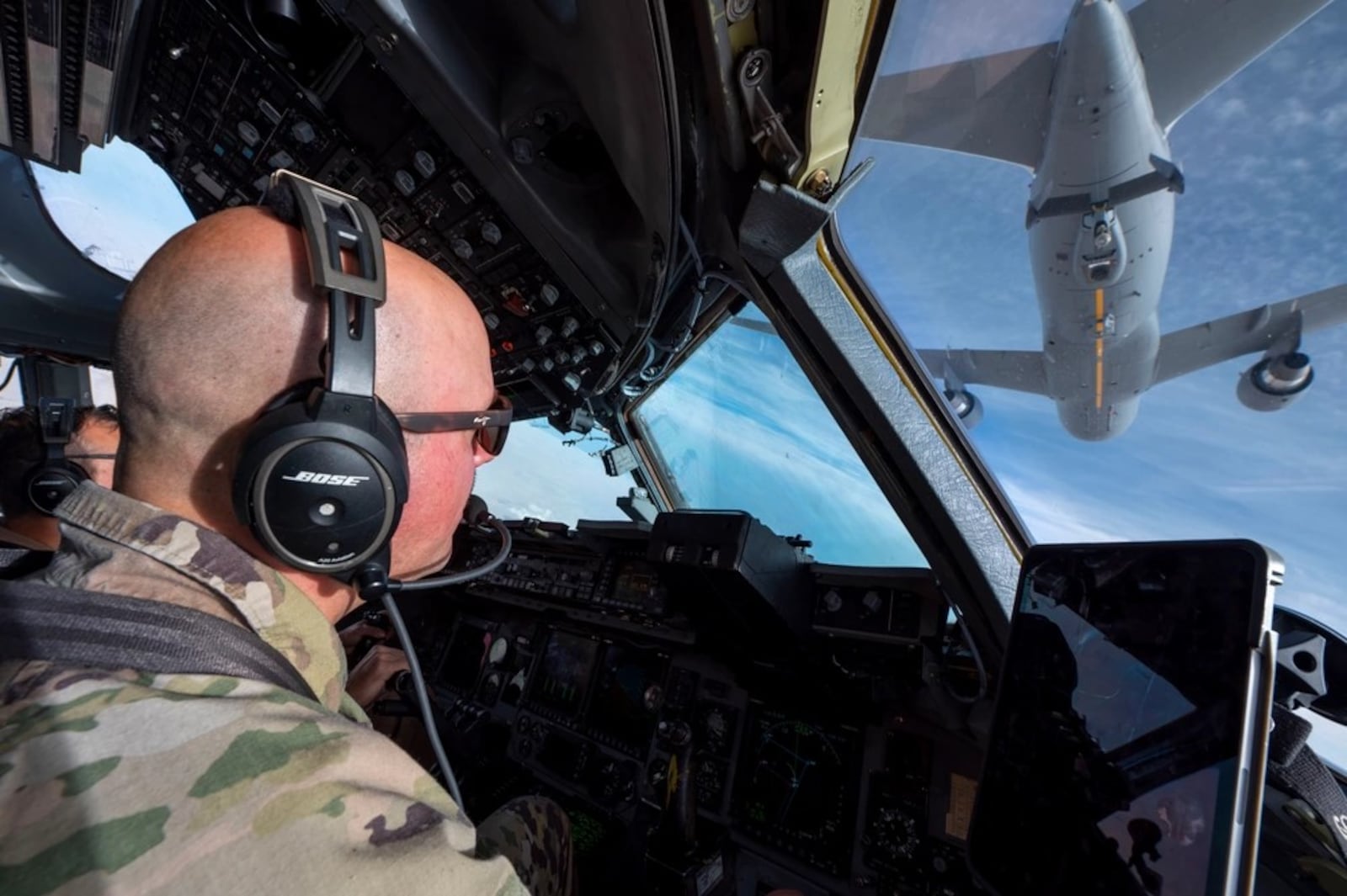 U.S. Air Force Lt. Col. Franics Saul, a C-17 Globemaster III pilot, prepares to conduct aerial refueling with a KC-46 Pegasus over an undisclosed location within the U.S. Central Command area of responsibility, Nov. 15, 2023. U.S. Air Force photo by Staff Sgt. Lawrence Sena