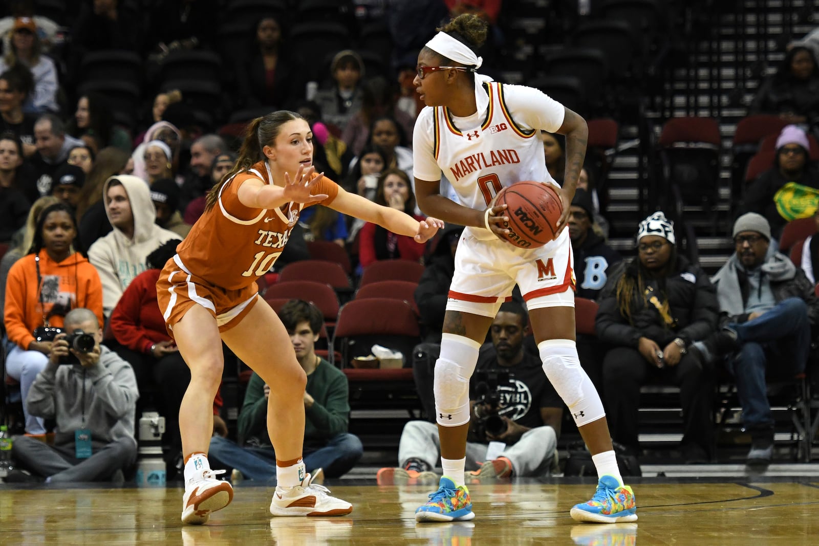 Maryland guard Shyanne Sellers, right, looks to pass the ball against Texas guard Shay Holle, left, during the first half of an NCAA college basketball game Monday, Jan. 20, 2025, in Newark, N.J. (AP Photo/Pamela Smith)