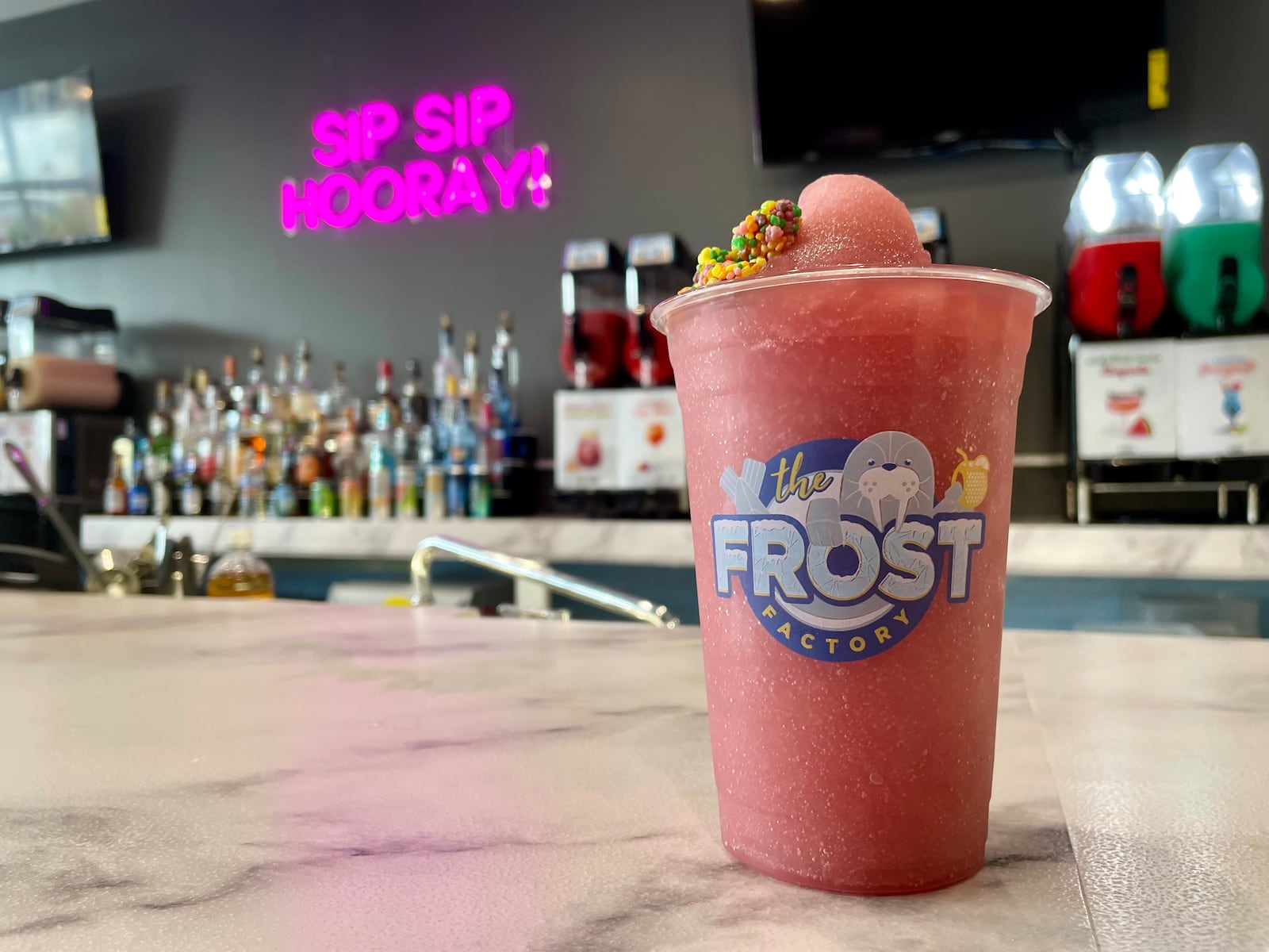 The Frost Factory, a boutique bar with boozy slushies, cocktails, shots and more, is now open at Austin Landing. NATALIE JONES/STAFF