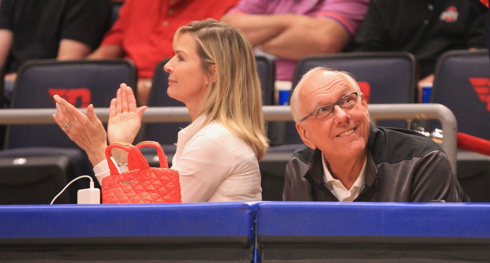 Syracuse coach Jim Boeheim, right, and his wife Juli watch Boeheim's Army against Team 23 in the championship game of The Basketball Tournament on Tuesday, Aug. 3, 2021, at UD Arena in Dayton. David Jablonski/Staff