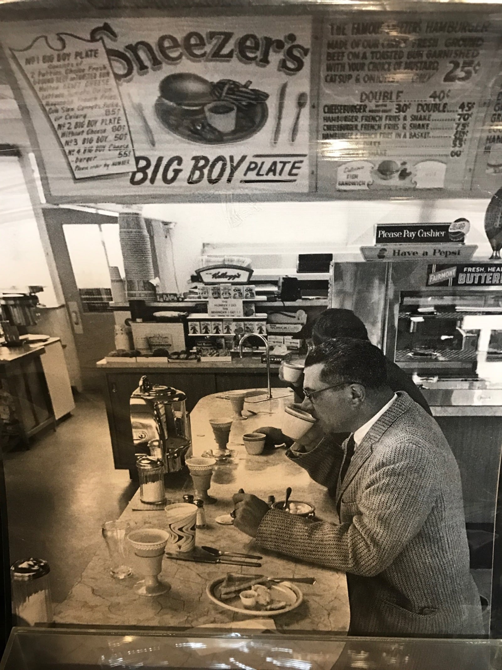 A photo of Coach Vince Lombardi at the lunch counter of Sneezer’s Snack Shop in Green Bay from Jack Giabrone's collection. The eatery made souvenir Packers ashtrays commemorating the 1960 season. Note that a hamburger at Sneezer’s cost 25 cents back then and a cheeseburger, fries and milkshake cost 75 cents. Tom Archdeacon/STAFF