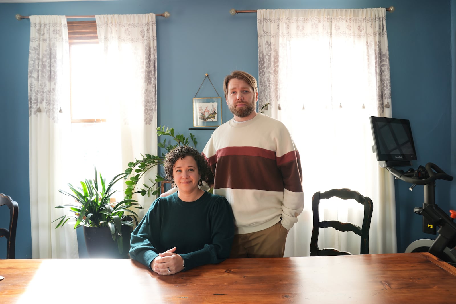 Hannah Jones accompanied by her spouse, Steve Cook, poses for a portrait at home near Philadelphia, Wednesday, March 12, 2025. (AP Photo/Matt Rourke)