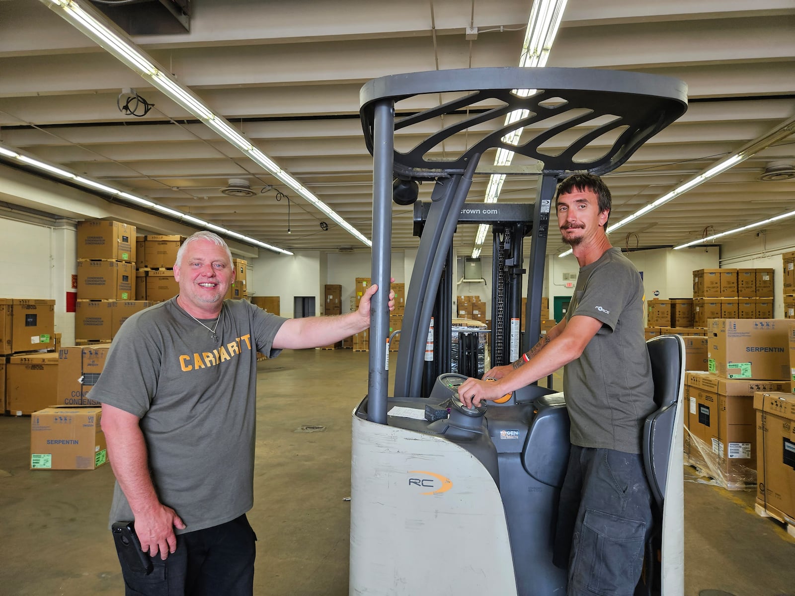 Michael Wise, left, with coworker Chris Doll at Five Star Services, a home services company. Wise has been with the company since 2020 and today is a warehouse manager. CONTRIBUTED