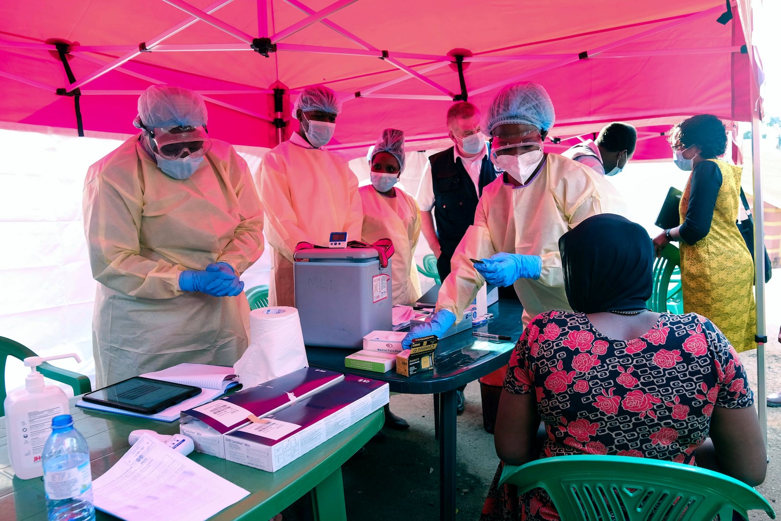 Health workers prepare to administer vaccines against the Sudan strain of Ebola, during a trial at Mulago Referral Hospital, in Kampala, Uganda Monday, Feb. 3, 2025. (AP Photo/Hajarah Nalwadda)