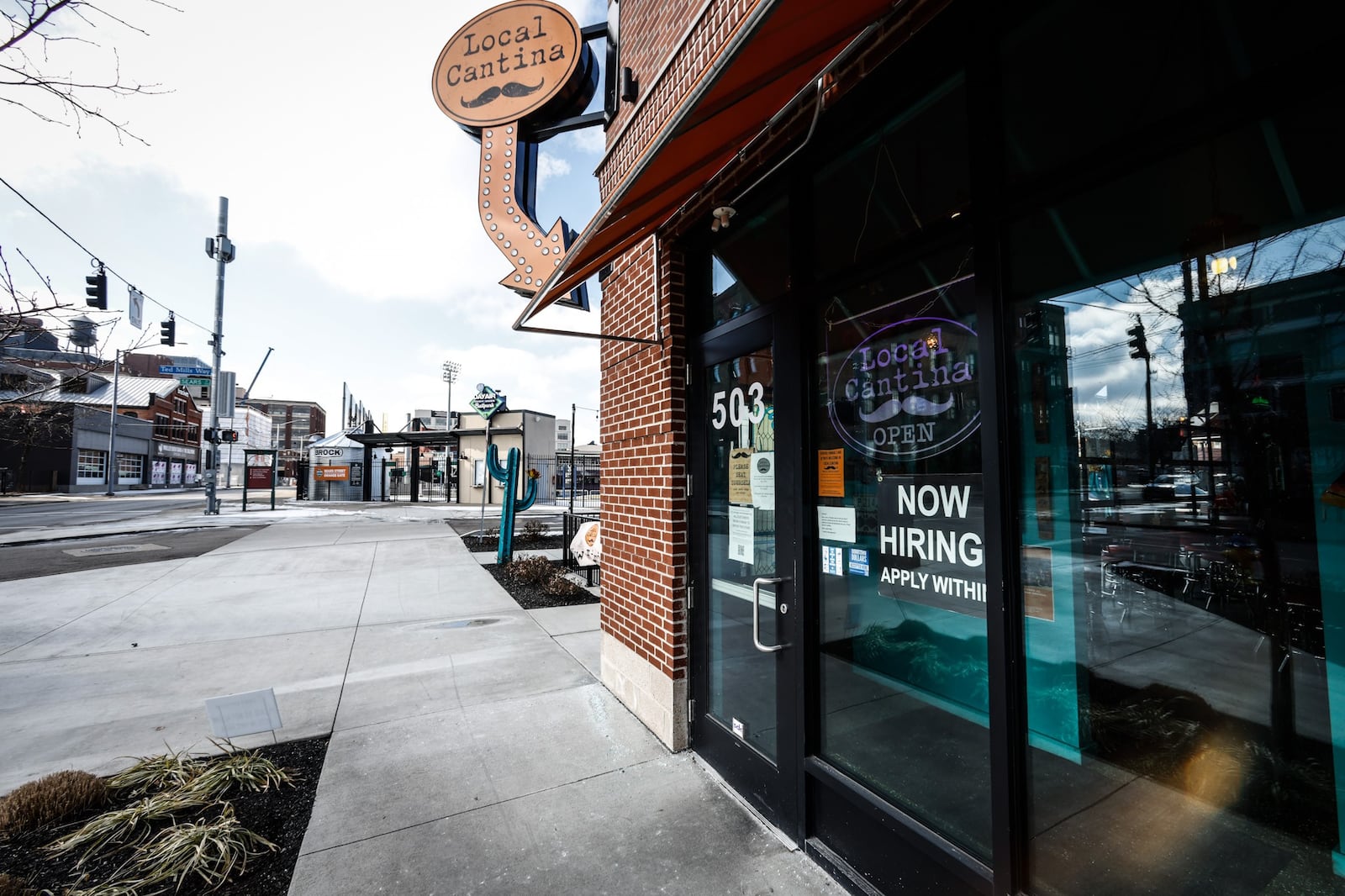 Like so many restaurants, the Local Cantina on East First Street in Dayton has a help-wanted sign on the front door. JIM NOELKER/STAFF