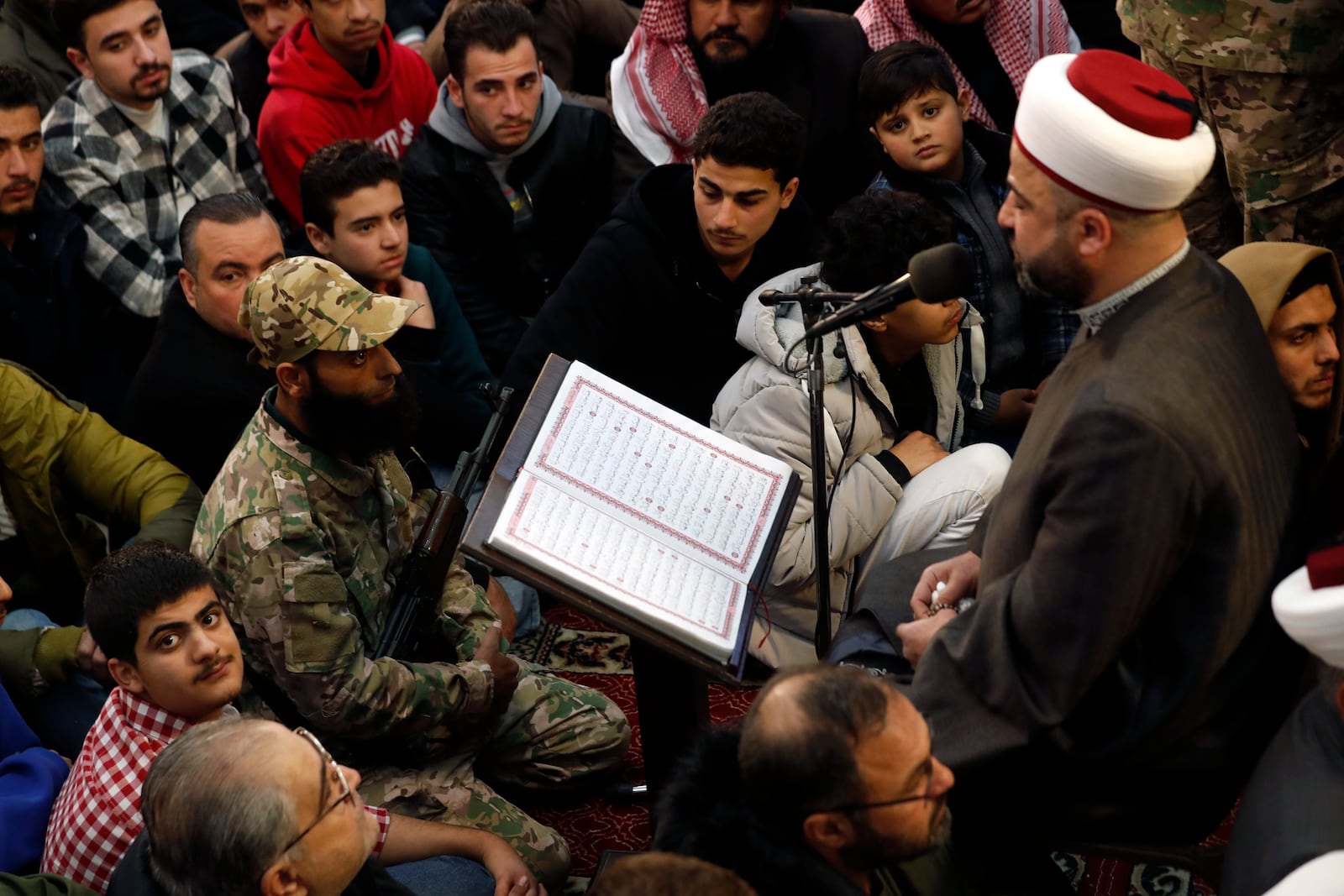 Syrians listen a Muslim cleric as they attend Friday prayers inside the 7th century Umayyad Mosque in Damascus, Syria, Friday, Dec. 13, 2024. (AP Photo/Omar Sanadiki)