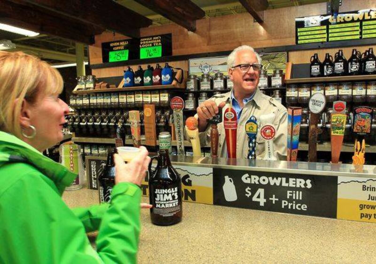 Jungle Jim’s Market named one of the best beer stores in America. Founder Jim Bonaminio is seen here serving drinks at the store in 2013. STAFF FILE PHOTO