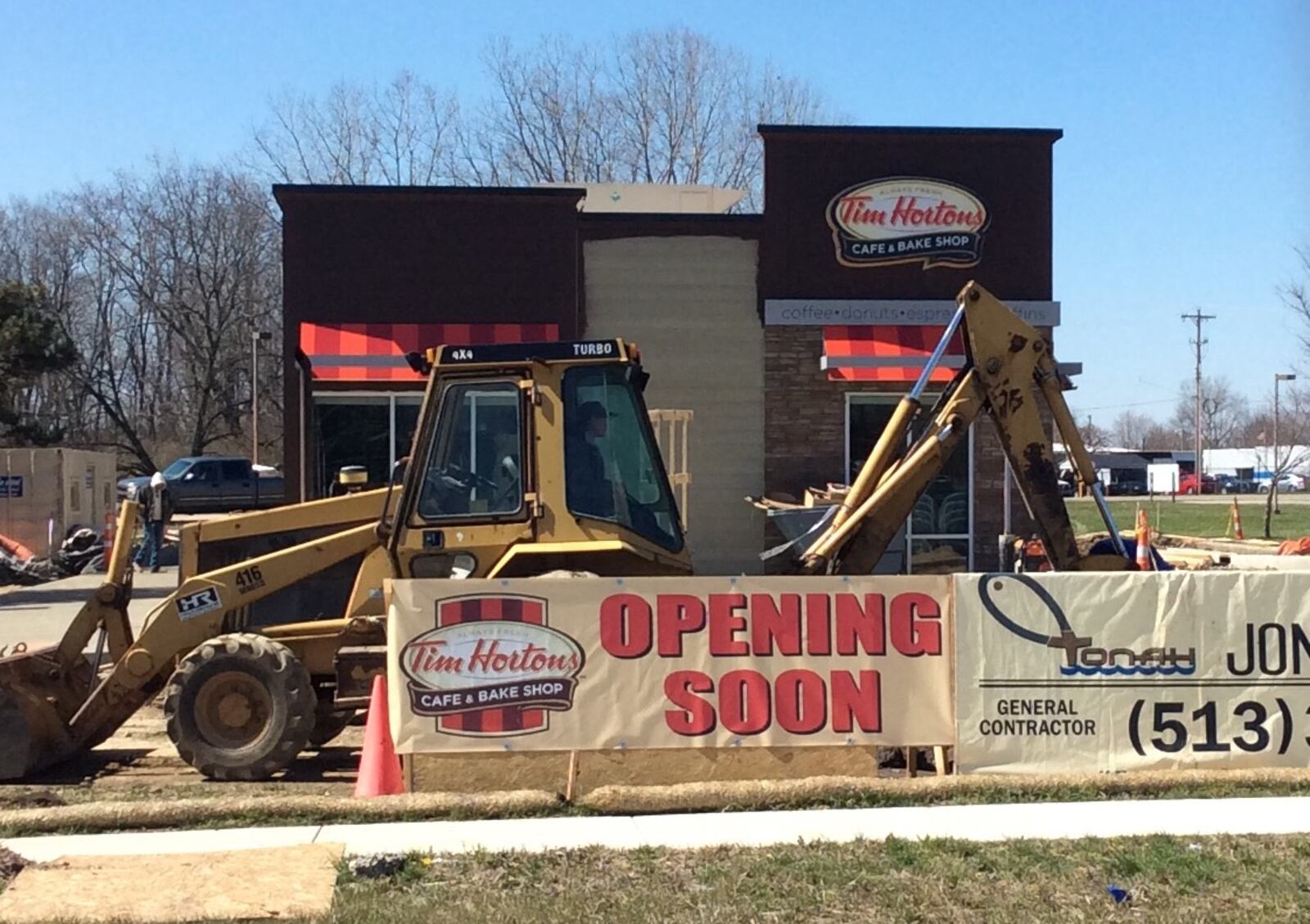 Construction crews were hard at work Wednesday on this new Tim Hortons location at 1975 Harshman Road just north of Ohio 4. MARK FISHER/STAFF