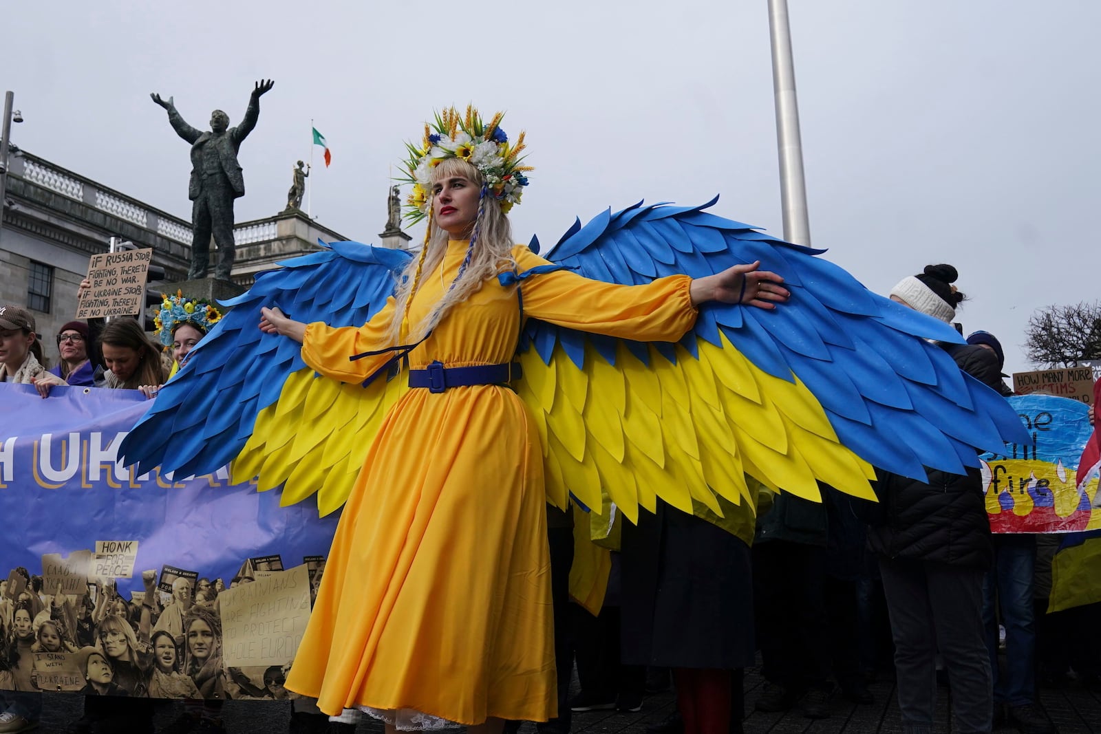 Uriivna Olena from Ukraine's Rivne region joins people taking part in a demonstration outside the GPO on O'Connell Street to mark three years since Russia invaded Ukraine, in Dublin, Sunday, Feb. 23, 2025. (Brian Lawless/PA via AP)