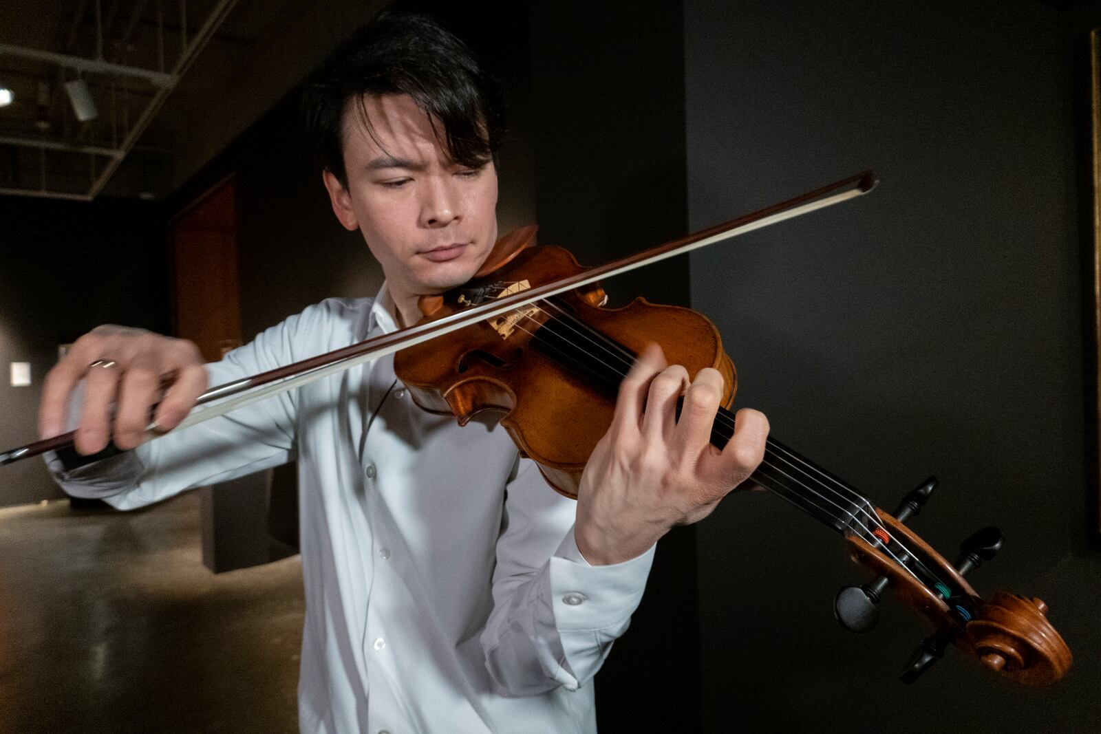 Violinist Stefan Jackiw plays the 1714 Joachim-Ma Stradivarius at Sotheby's auction house in New York on Monday, Feb. 3, 2025. (AP Photo/Ted Shaffrey)