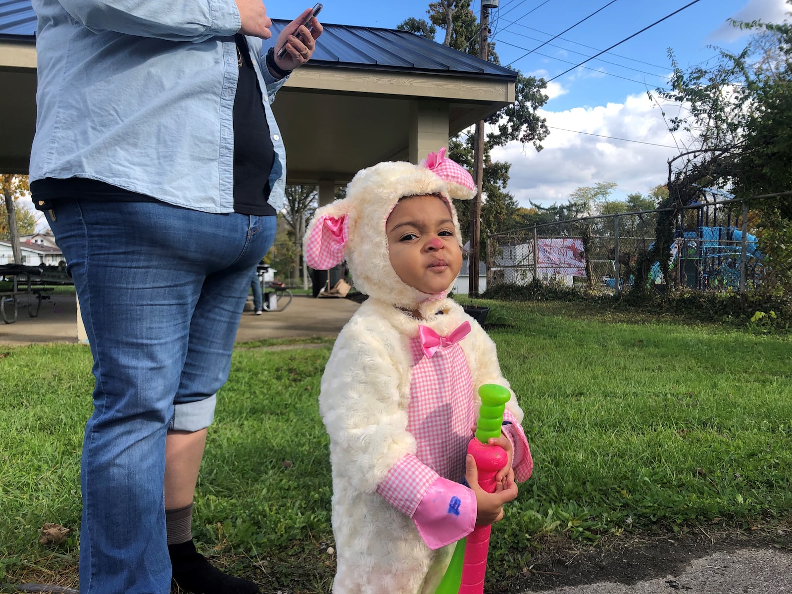 Nouveau Thomas, 2, plays at Ridgecrest Park on Sunday. She dressed as a lamb for Halloween. CORNELIUS FROLIK / STAFF