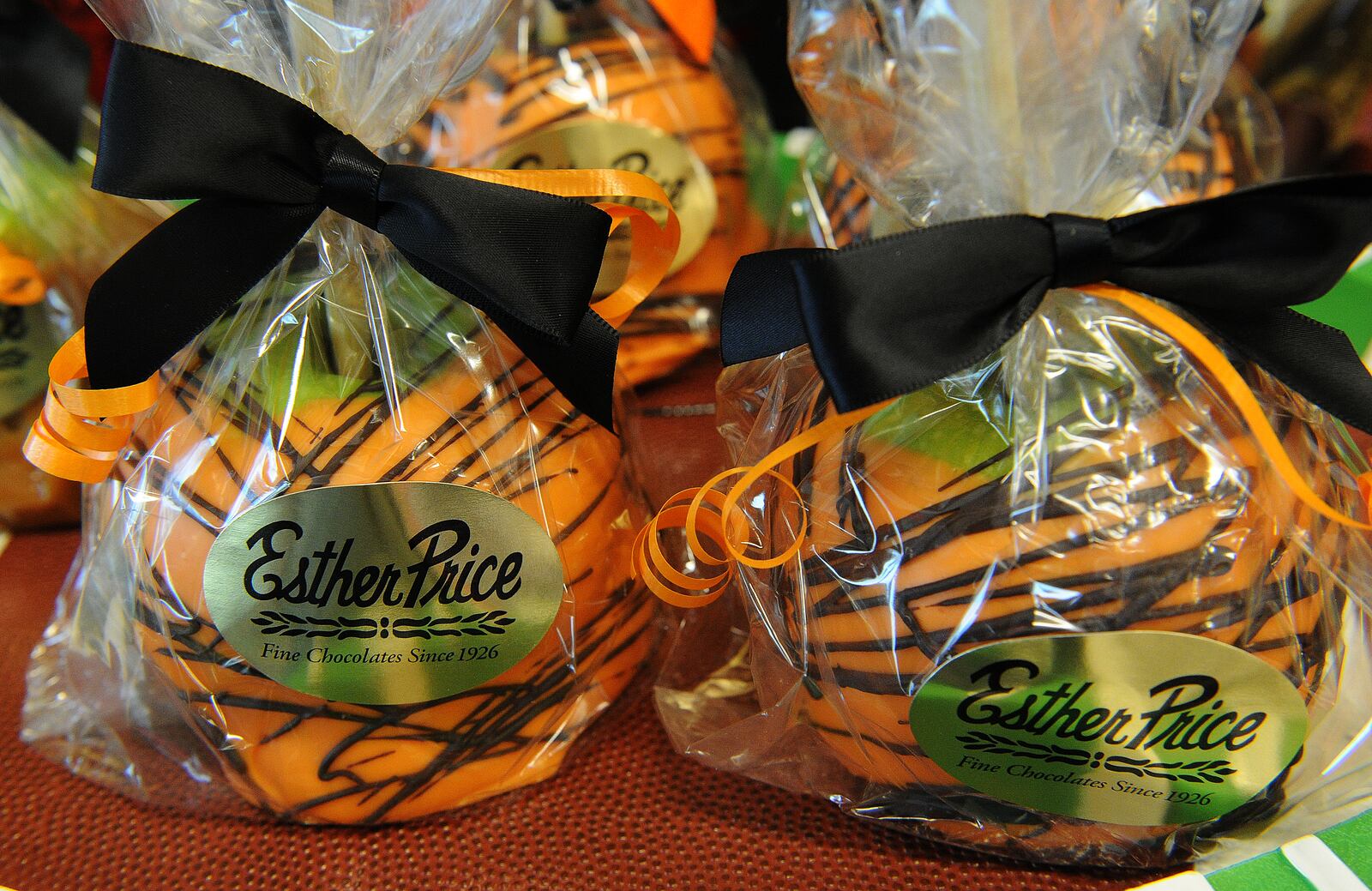 Esther Price Candies, has orange and black striped chocolate covered Oreos, caramel apples and four pound chocolate footballs at the Woodman Dr. location. MARSHALL GORBY\STAFF