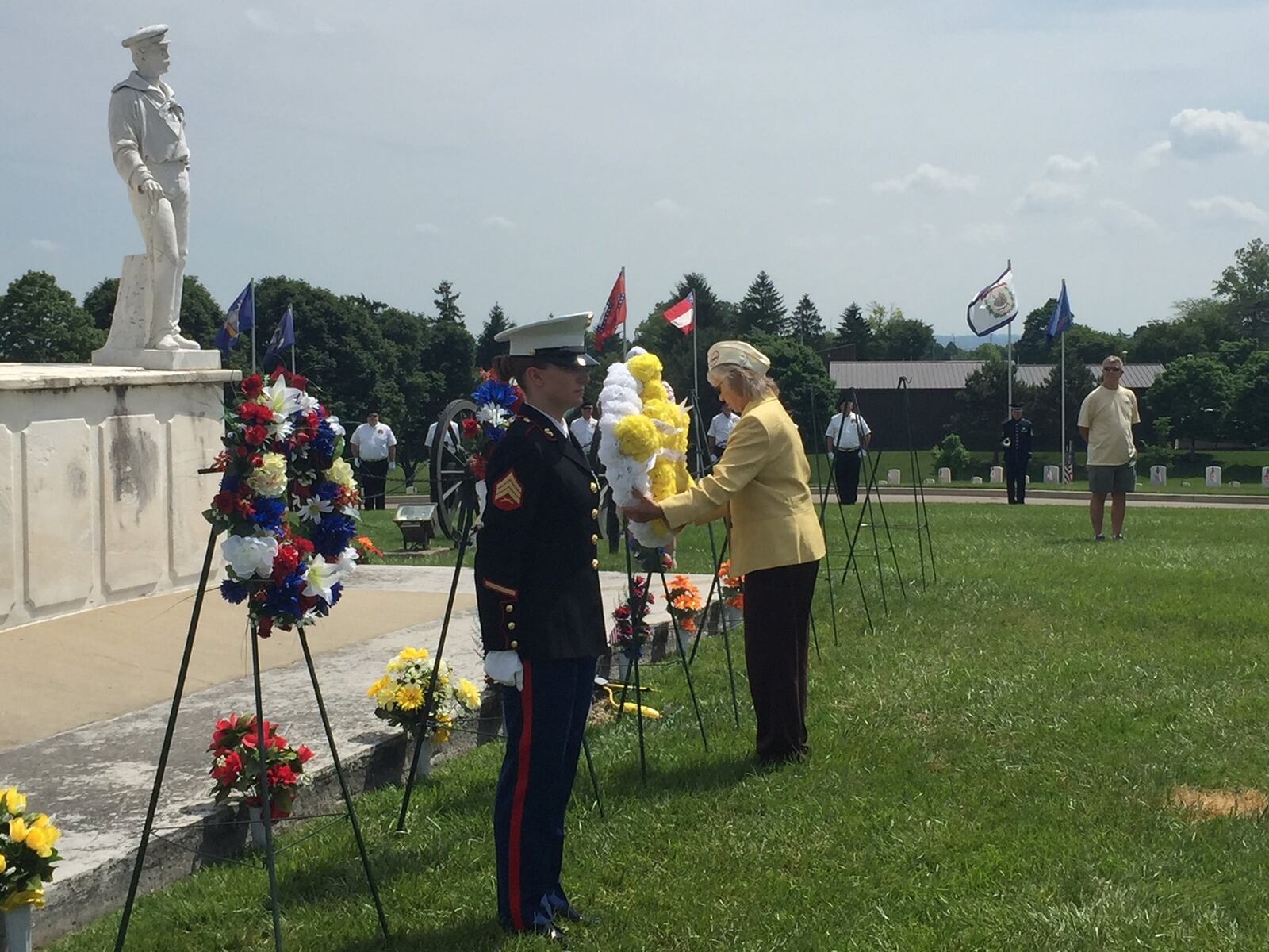 Cindy LaPointe-Dafler, a Gold Star wife of Medal of Honor recipient and Army soldier Joseph G. LaPointe, Jr., who died in Vietnam, lays a wreath at a 2018 Memorial Day ceremony at Dayton National Cemetery. CHUCK HAMLIN / STAFF