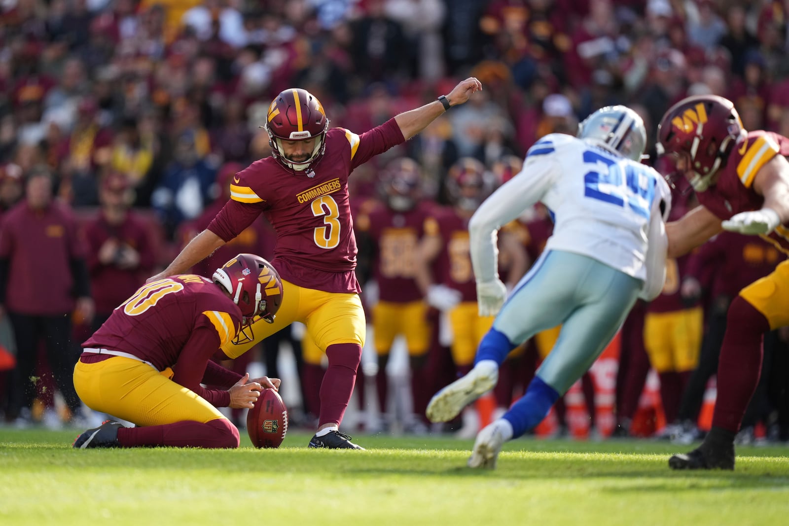 Washington Commanders place kicker Austin Seibert (3) kicks a 41-yard field goal during the first half of an NFL football game against the Dallas Cowboys, Sunday, Nov. 24, 2024, in Landover, Md. (AP Photo/Stephanie Scarbrough)