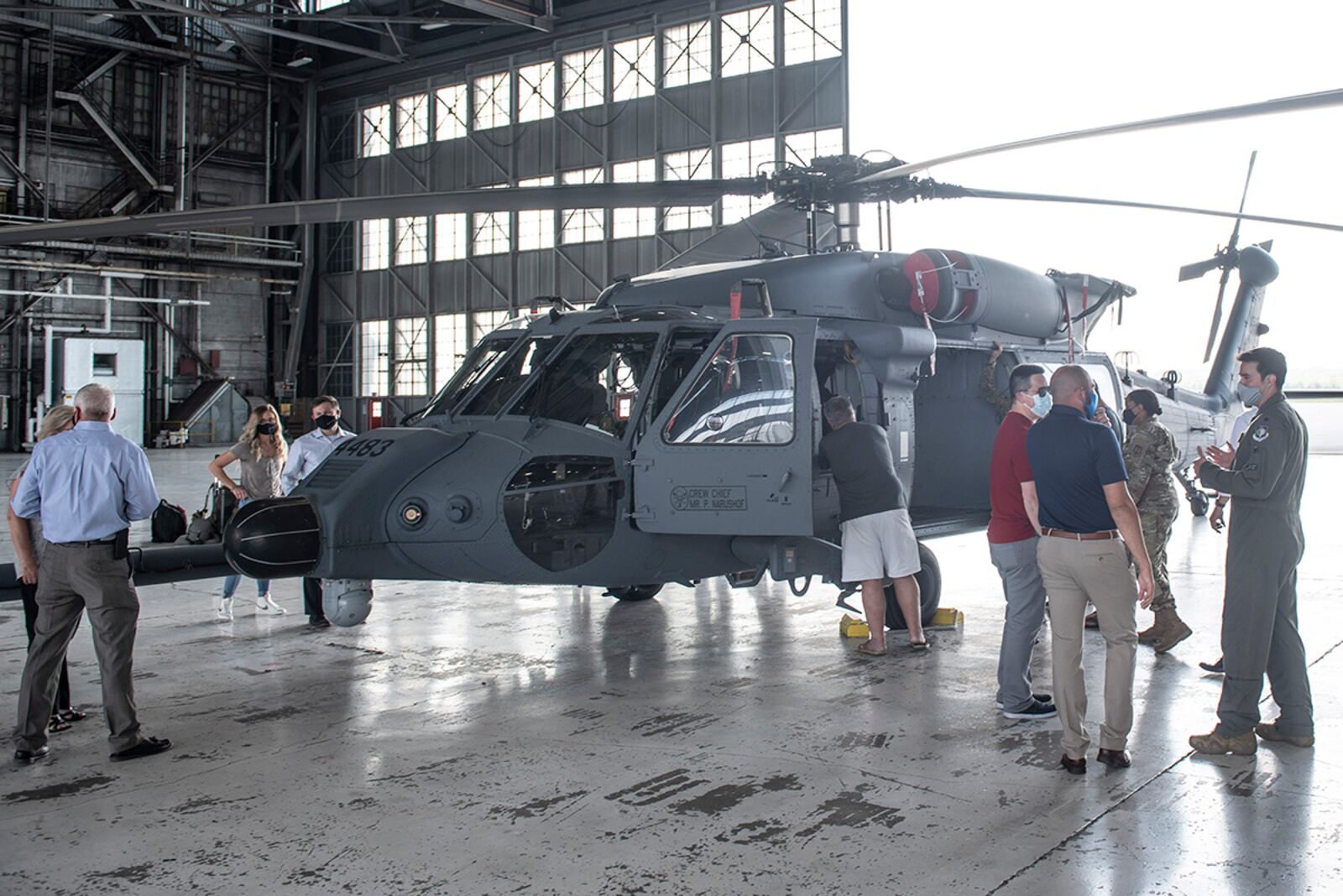 Members of the Air Force Life Cycle Management Center’s Helicopter Program Office tour an HH-60W Jolly Green II helicopter Sept. 1 during its overnight stay at Wright-Patterson Air Force Base. U.S. AIR FORCE PHOTO/WESLEY FARNSWORTH