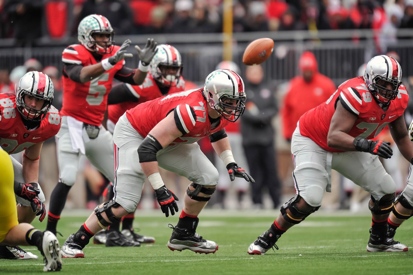 COLUMBUS, OH - NOVEMBER 24: Reid Fragel #77 of the Ohio State Buckeyes blocks against the Michigan Wolverines at Ohio Stadium on November 24, 2012 in Columbus, Ohio. (Photo by Jamie Sabau/Getty Images)