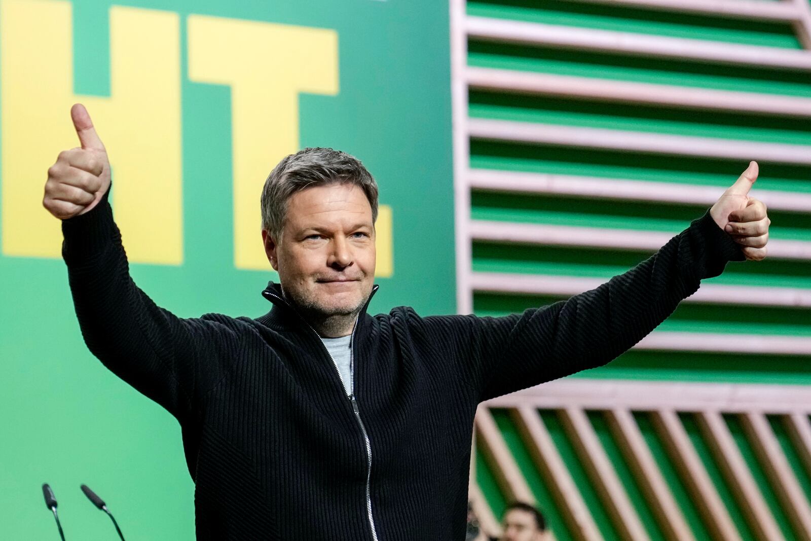 FILE - Federal Minister for the Economy Robert Habeck, of the Green Party, gives a thumbs up to applause after his speech at a party convention in Berlin, Germany, Jan. 26, 2025. (AP Photo/Ebrahim Noroozi, File)