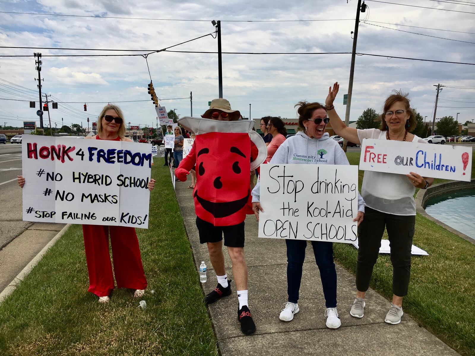 More than 40 supporters of a local chapter of “Free Ohio Now” held a road-side demonstration Saturday in Butler County’s West Chester Township advocating for a returning to traditional, in-person learning for K-12 students when the 2020-2021 school year starts in August. The group contends state health officials – and local school districts – are overreacting to the coronavirus and shouldn’t require students to social distance in schools, wear masks or continue the remote learning mandated by Ohio in March as the next school begins.
(Photo By Michael D. Clark/Journal-News)