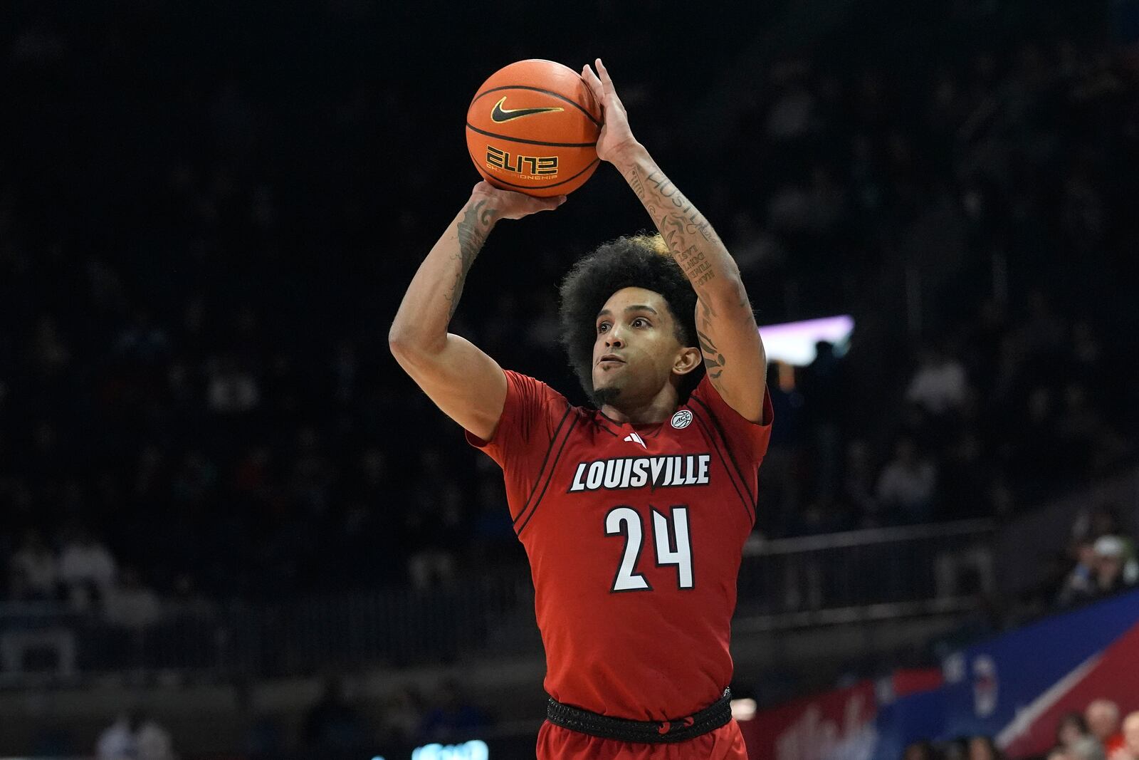 Louisville guard Chucky Hepburn (24) shoots during the first half of an NCAA college basketball game against SMU Tuesday, Jan. 21, 2025, in Dallas. (AP Photo/LM Otero)