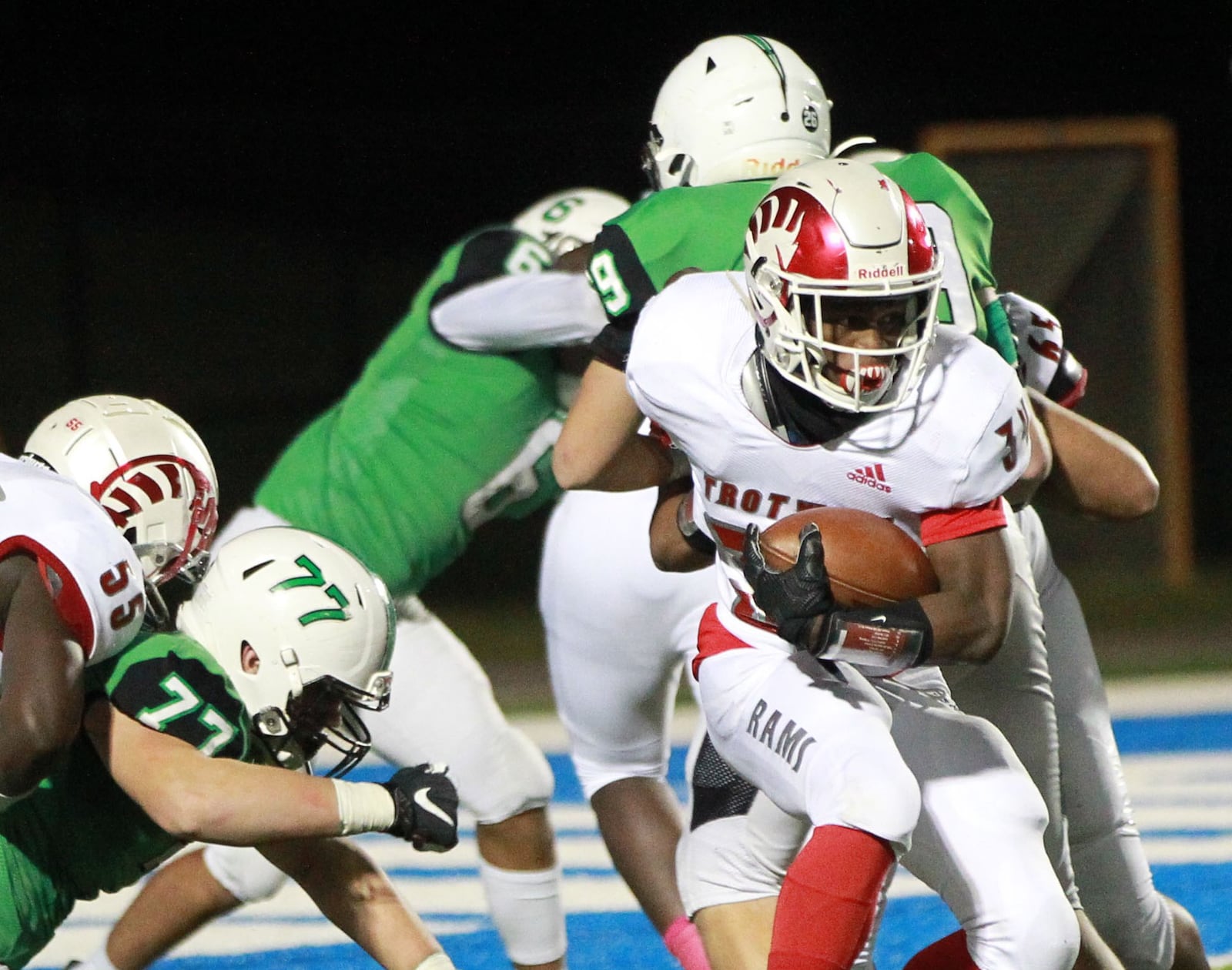 Hezekiah Hudson-Davis of Trotwood (with ball) takes off. Trotwood-Madison defeated Badin 20-7 in a D-III, Region 12 high school football final at Miamisburg on Friday, Nov. 22, 2019. MARC PENDLETON / STAFF