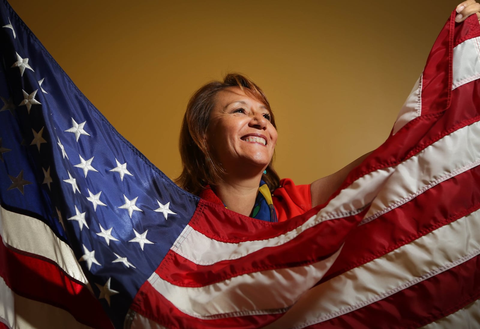 Martha Jeanette Rodriguez, is a fair housing manager for Welcome Dayton, a native of Columbia who became a U.S. citizen in April 2013. JIM WITMER/STAFF