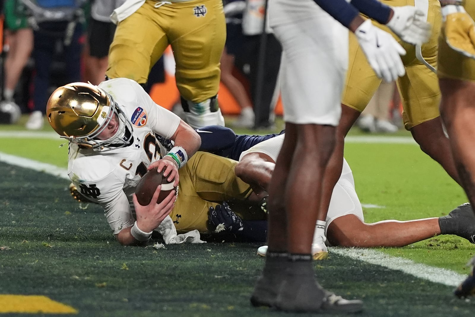 Notre Dame quarterback Riley Leonard (13) scores a touchdown during the second half of the Orange Bowl NCAA College Football Playoff semifinal game against Penn State, Thursday, Jan. 9, 2025, in Miami Gardens, Fla. (AP Photo/Lynne Sladky)