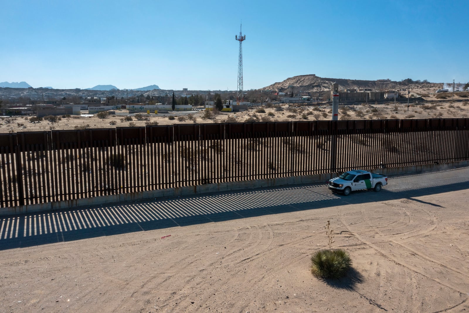 A Border Patrol truck rides along the border wall in Sunland Park, N.M., Tuesday, Jan. 21, 2025. (AP Photo/Andres Leighton)