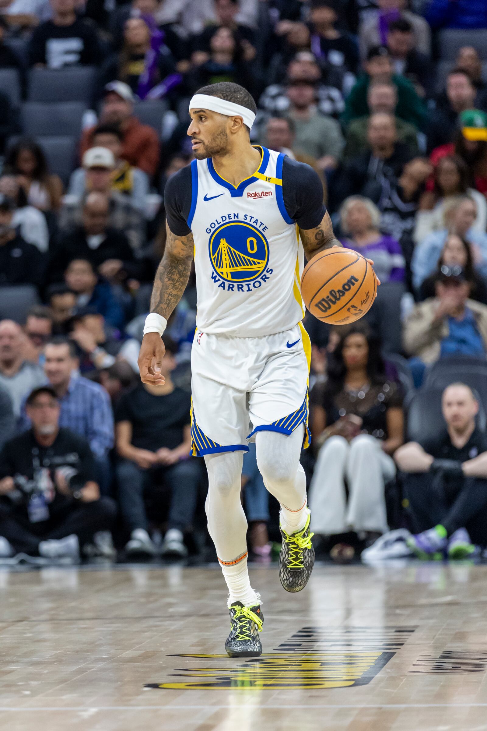 Golden State Warriors guard Gary Payton II dribbles upcourt during the second half of an NBA basketball game against the Sacramento Kings Wednesday, Jan. 22, 2025, in Sacramento, Calif. (AP Photo/Sara Nevis)