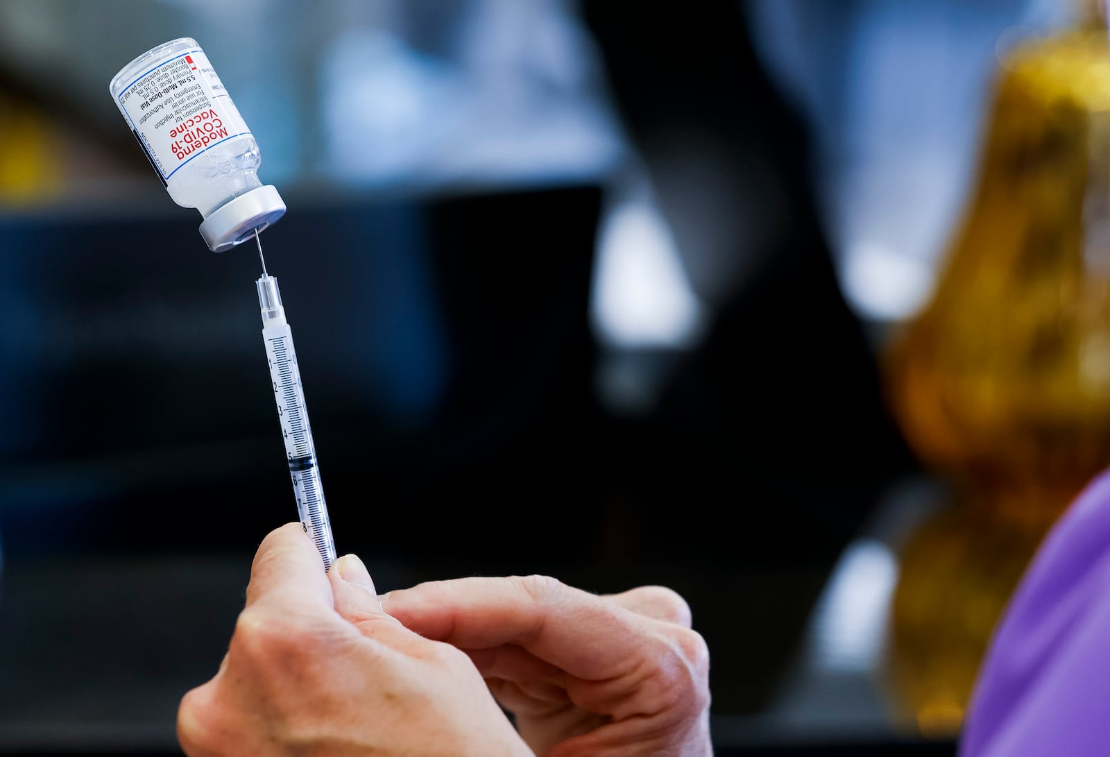 Kathryn Yang, Nursing Administrator for City of Hamilton Health Department, gives COVID-19 vaccines during a clinic at Hamilton city building Thursday, Sept. 1, 2022. NICK GRAHAM/STAFF NICK GRAHAM/STAFF