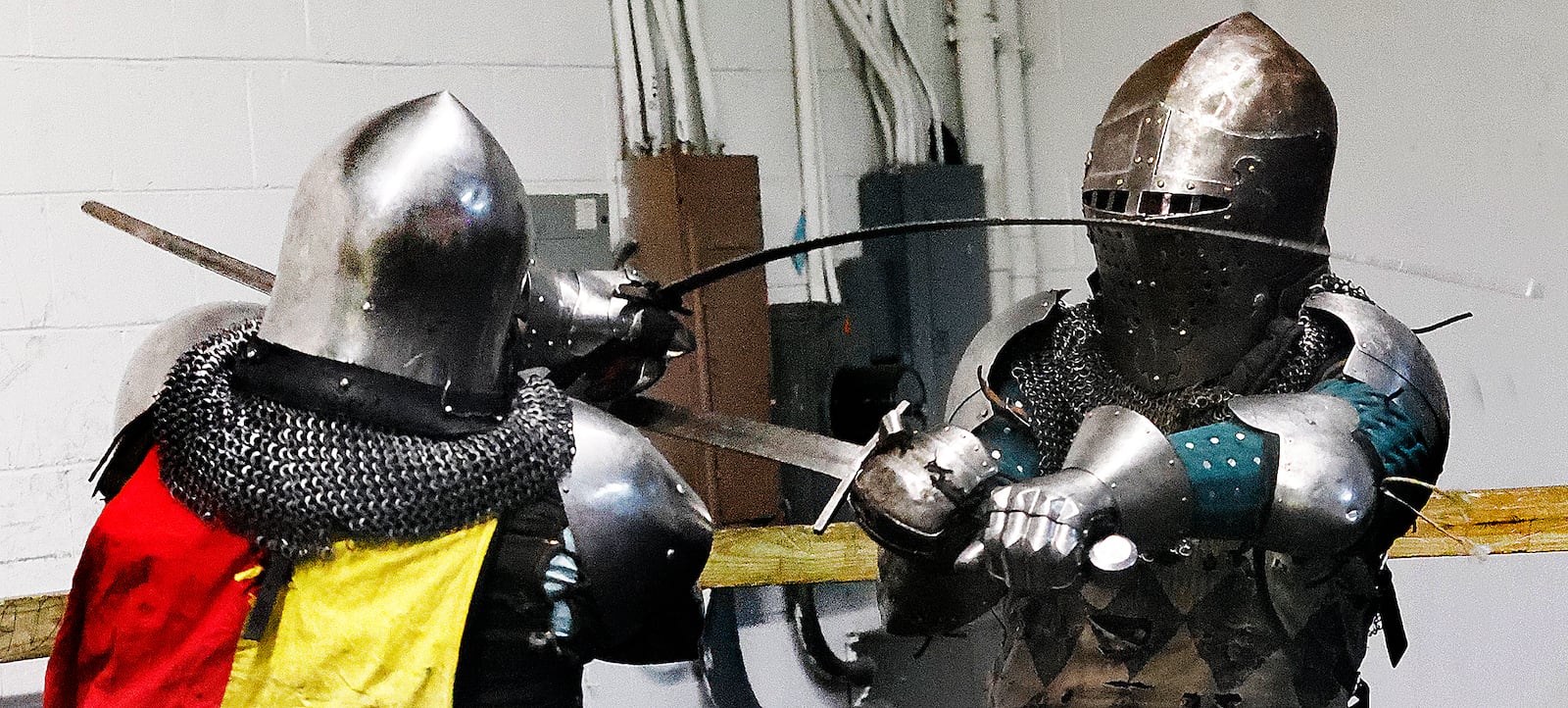 Chris Milesky (left) squares off with Jay Bishop (right) moments before his sword breaks during a Cincinnati Barbarians practice Thursday, Feb. 13, 2025. MARSHALL GORBY\STAFF