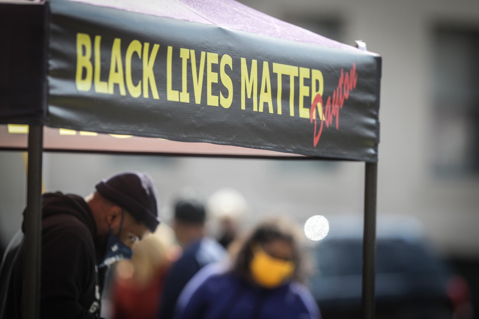 Community members gathered for a rally by Black Lives Matter Dayton near the old NAACP building in the 1500 block of West Third Street on Wednesday. Organizers said the rally was to stand in concert with other groups across the country protesting the killing of Black men and women by police. JIM NOELKER/STAFF