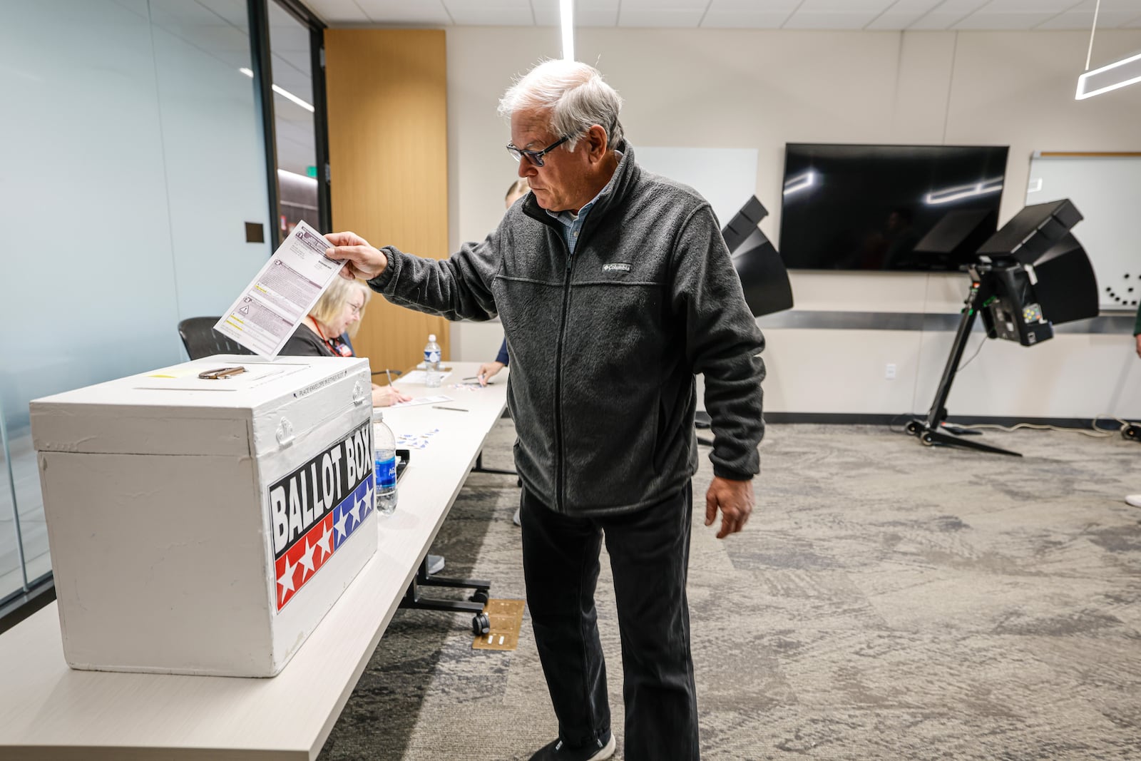 A voter casts a ballot during early voting in Waukesha, Wis., Tuesday, March 18, 2025. (AP Photo/Jeffrey Phelps)