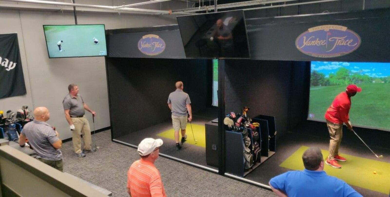 Golf simulators at the Golf Club at Yankee Trace in Centerville. CONTRIBUTED